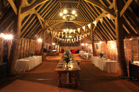 A photo of a traditional barn that has been prepared for a wedding with bunting. The barn is located in Lavenham in the UK. Barn, Pre-wedding, Traditional, Culture, architecture, beams, wood, building, English, British.