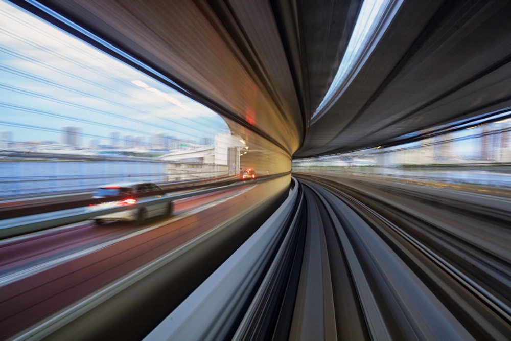 A motion blur photo taken from a train passing along the Odaiba bridge in Tokyo. This is one of the best creative photos Simon Bond took in 2018.