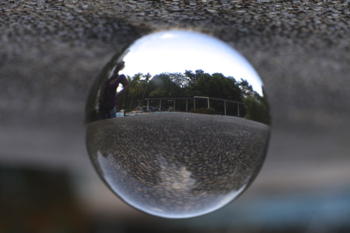 A Lensball is placed on the ground, this is not an interesting photo.